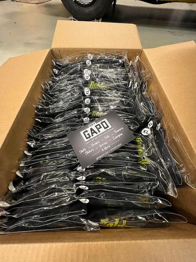 Printed GAPD shirts individually folded and bagged with size labels